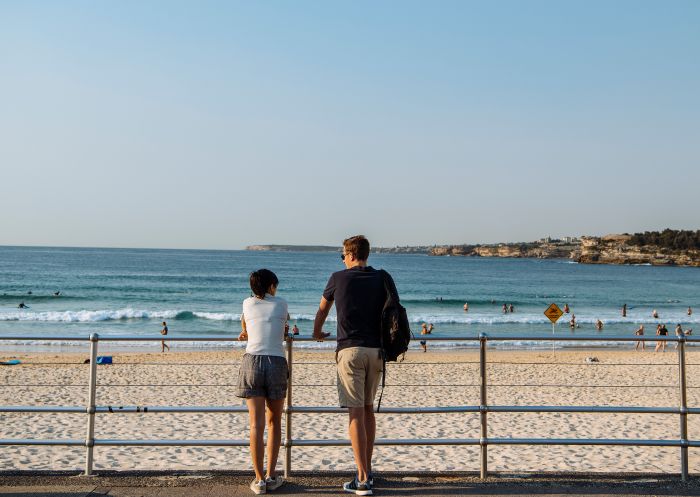 Couple enjoying a walk along Bondi Beach, Bondi