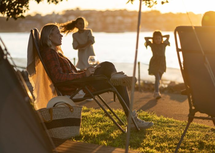 Family relaxing on Cockatoo Island's waterfront campground, Cockatoo Island 