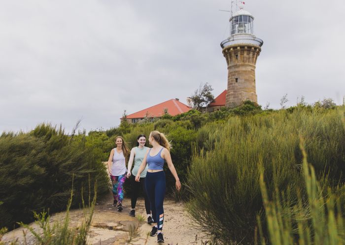 Friends enjoying a walk along the Barrenjoey Lighthouse walk, Palm Beach