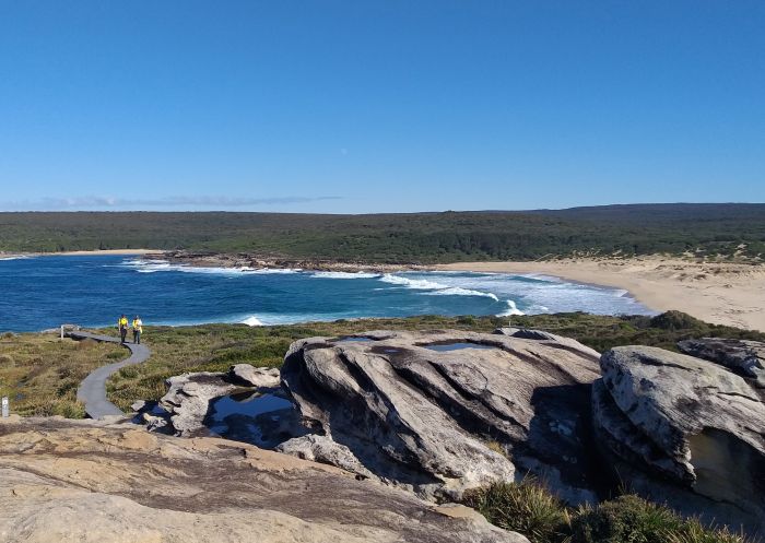 People walking the Bundeena to Wedding Cake Rock coastal walk, Royal National Park