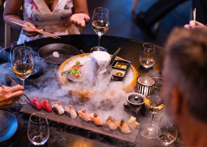 Friends enjoying food and drink at Sokyo restaurant, Pyrmont