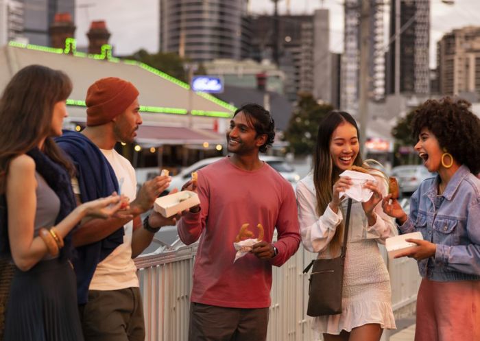 Friends walking through Little India, Harris Park