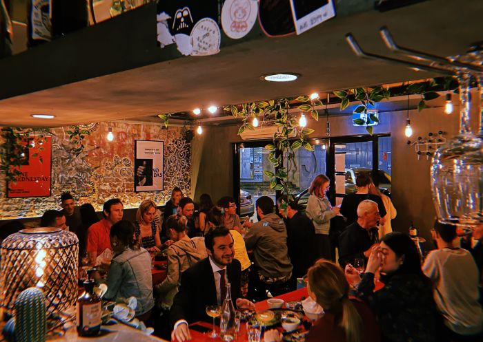 Group of people dining at Bad Hombres, Surry Hills