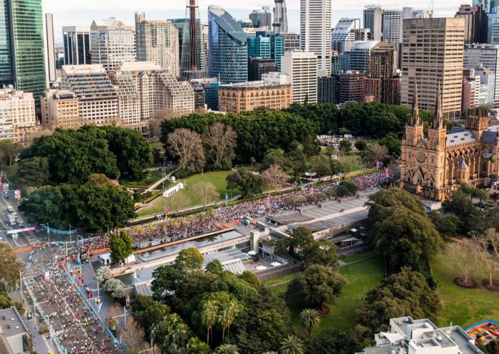 Runners racing through the streets of Sydney at the City2Surf, Sydney CBD