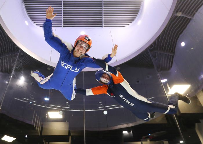 Instructor and woman enjoying indoor skydive at iFLY Indoor Skydiving Downunder, Penrith