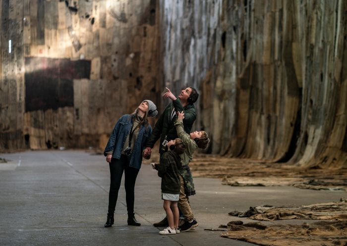 Family enjoying a self-guided audio tour on Cockatoo Island in Sydney Harbour