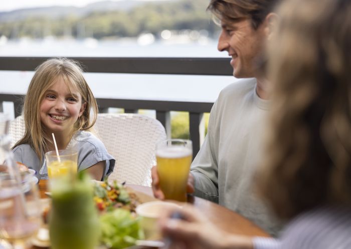 Family enjoying food and drink at The Newport, Newport with scenic views of Pittwater