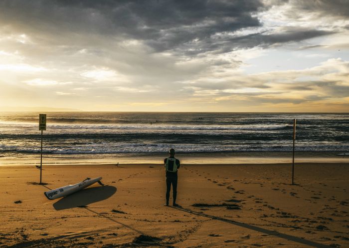 Man watching the sunrise at South Cronulla Beach, Cronulla