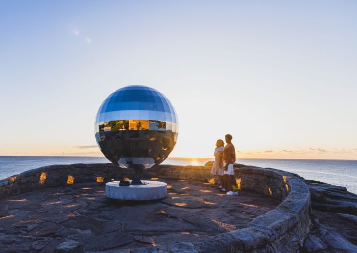 Friends enjoying Sculpture by the Sea 2022 at Mackenzie's Point Lookout, Bondi