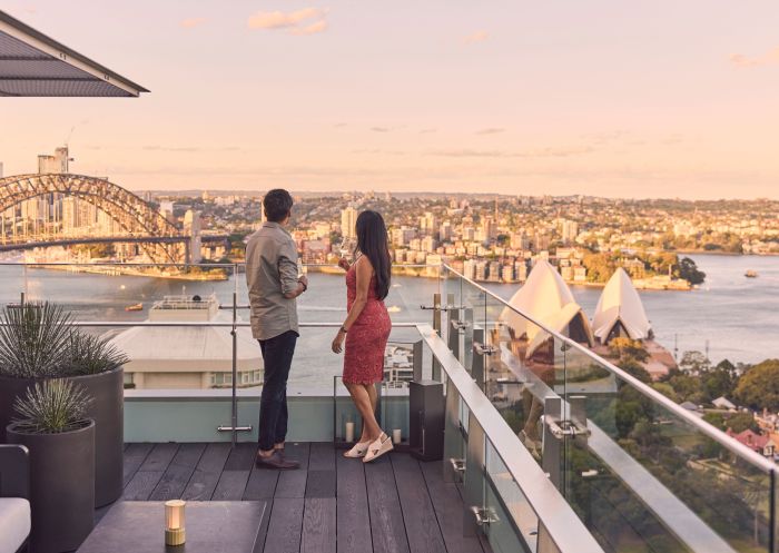 Couple enjoying the view of Sydney Harbour at The Aster Bar at The Intercontinental, Sydney 