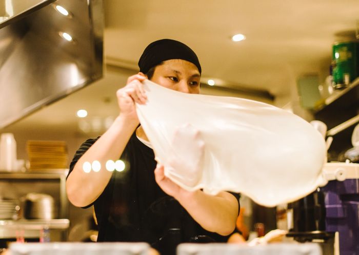 Chef preparing roti at Mamak, Haymarket