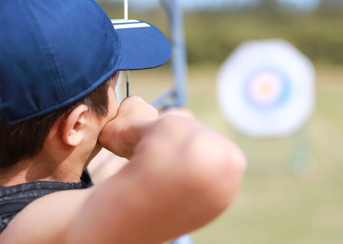 Boy taking aim at Sydney Olympic Park Archery Centre, Homebush