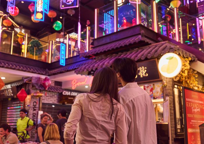 Couple enjoying street food at Burwood Chinatown, Burwood