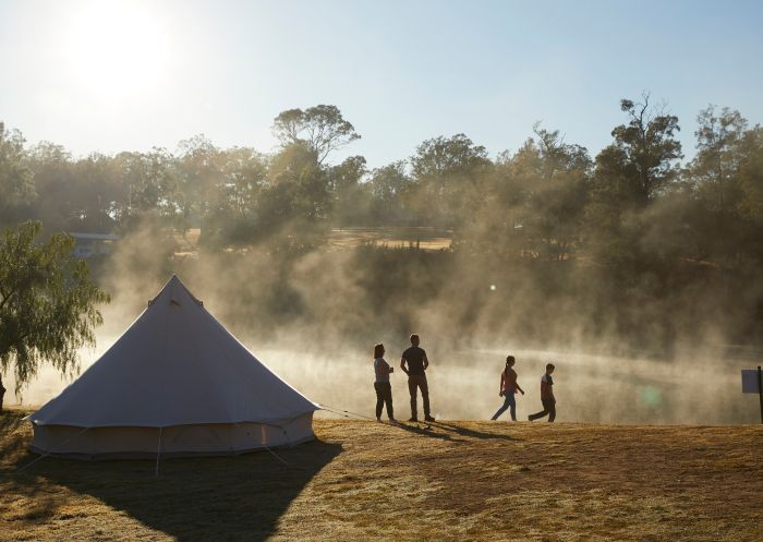 Family enjoying the morning sun and mist on the Hawkesbury River at Percy's Place Caravan Park, Pitt Town