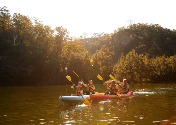Family enjoying a day of kayaking on the Nepean River, Penrith