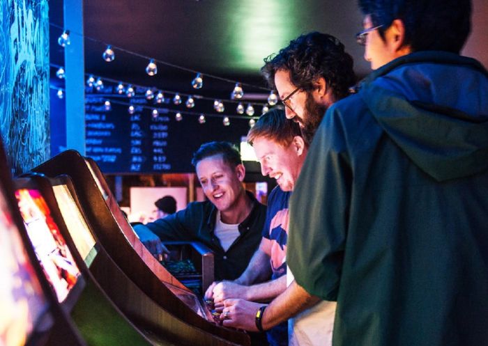  Friends playing arcarde games at 1989 Arcade Bar, Newtown