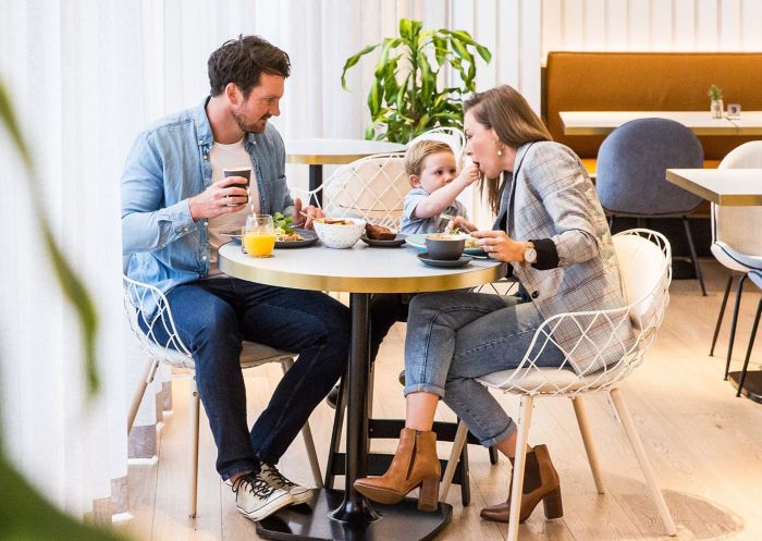 Family enjoying breakfast at Novotel Sydney Darling Square, Darling Square