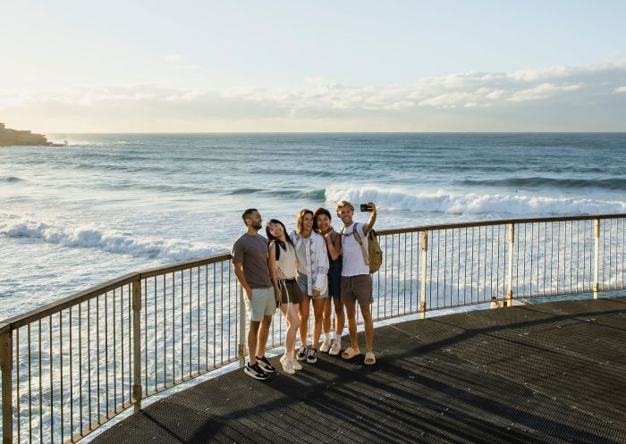 Friends taking a selfie with views of the southern end of Bondi Beach, Bondi