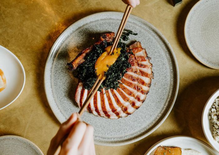 Smoked pork cutlet, sticky soy glaze, calvo nero, egg yolk at Yan, Wolli Creek