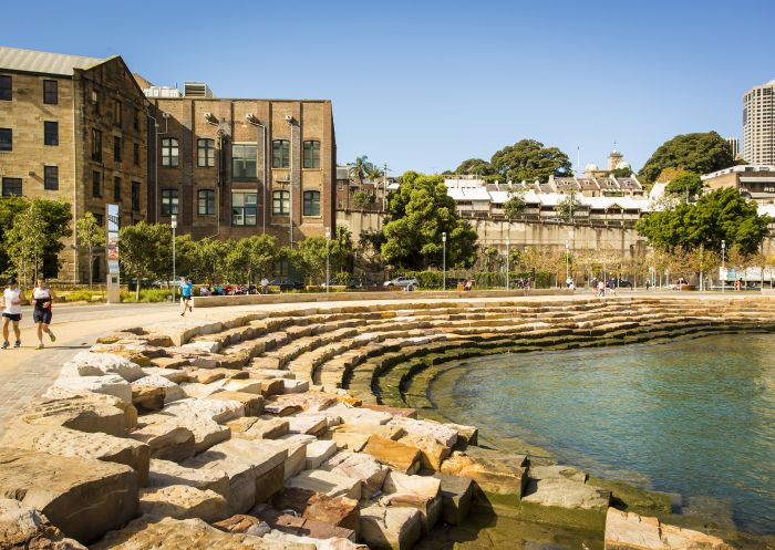 Men running through by Nawi Cove, Barangaroo Reserve, Barangaroo, Sydney City