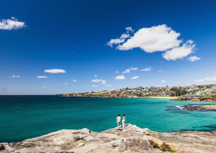 Couple overlooking coastal views from Tamarama to Coogee, Tamarama