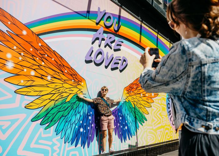 Couples take photo at Oxford Street Fair at Sydney WorldPride 2023, Sydney
