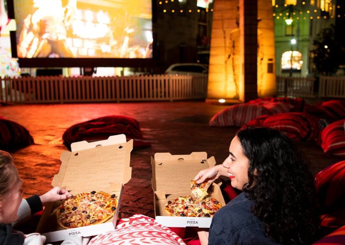 Friends enjoying pizza at Laneway Cinema at The Rocks, The Rocks