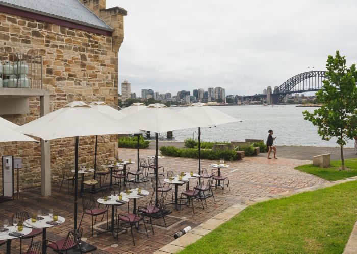 Outdoor dining area overlooking the harbour at The Fenwick, Balmain