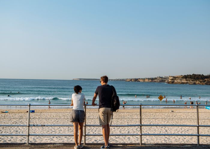 Couple standing at Bondi beach on the Bondi to Manly Walk, Bondi Beach
