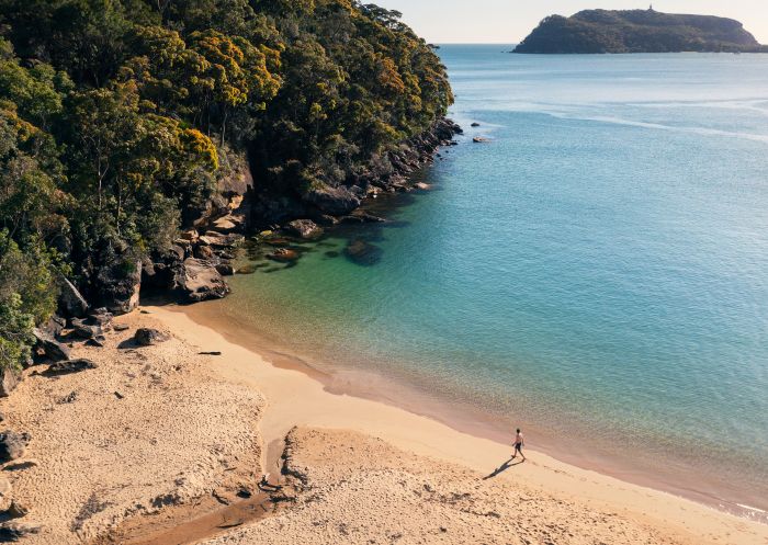 Man enjoying a morning walk along Resolute Beach, Ku-ring-gai Chase National Park
