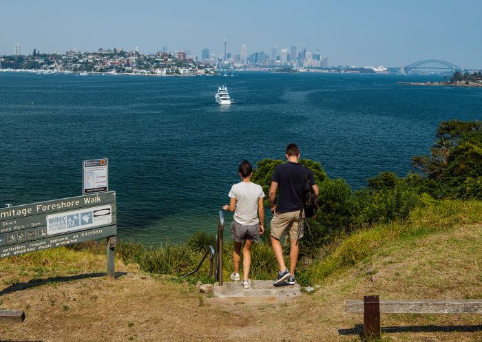 Couple enjoying scenic views across Sydney Harbour along the Hermitage Foreshore Walk, Vaucluse