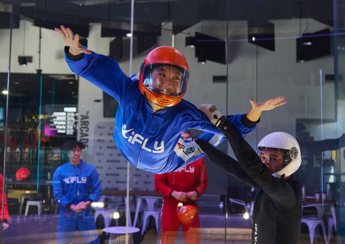 Friends enjoying an indoor sky dive at iFLY Downunder, Penrith
