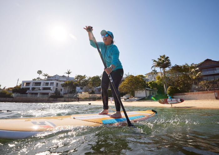 Woman enjoying WATSSUP Watsons Bay Stand Up Paddling, Watsons Bay