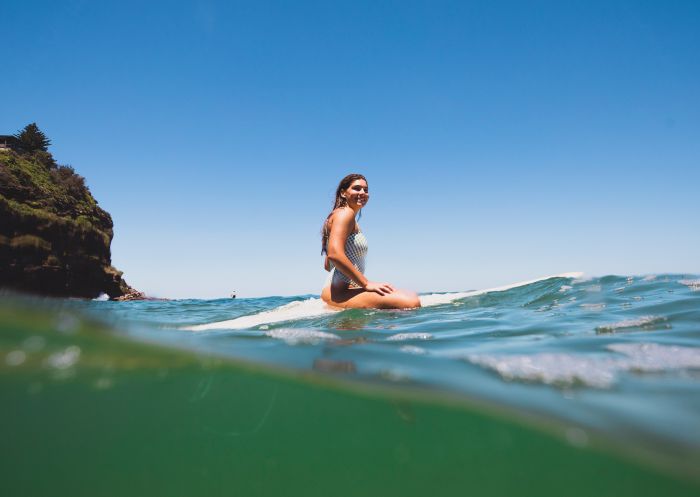 Surfer in the water at Bilgola Beach, Northern Beaches