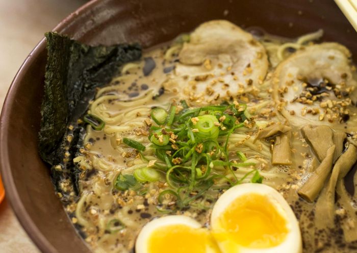 Bowl of ramen with boiled egg at Gumshara Ramen, Haymarket