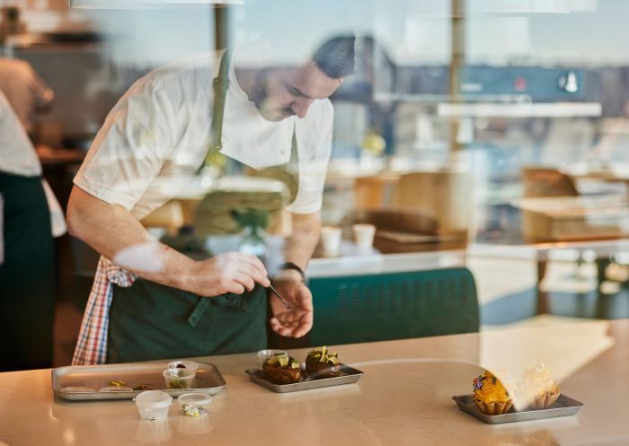 Oncore by Clare Smyth at Crown Towers, Barangaroo Chef adding finishing touches to a dish at Oncore by Clare Smyth at Crown Towers, Barangaroo