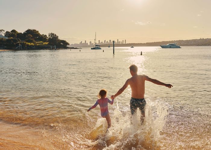 Father and child enjoying the water at Camp Cove, Watsons Bay