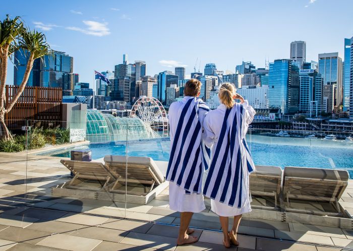 Sofitel Sydney, Darling Harbour Couple enjoying the view from the pool at Sofitel Sydney, Darling Harbour
