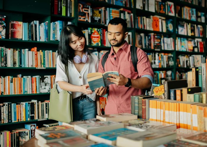 Couple browsing books at Elizabeth's Bookshop, Newtown