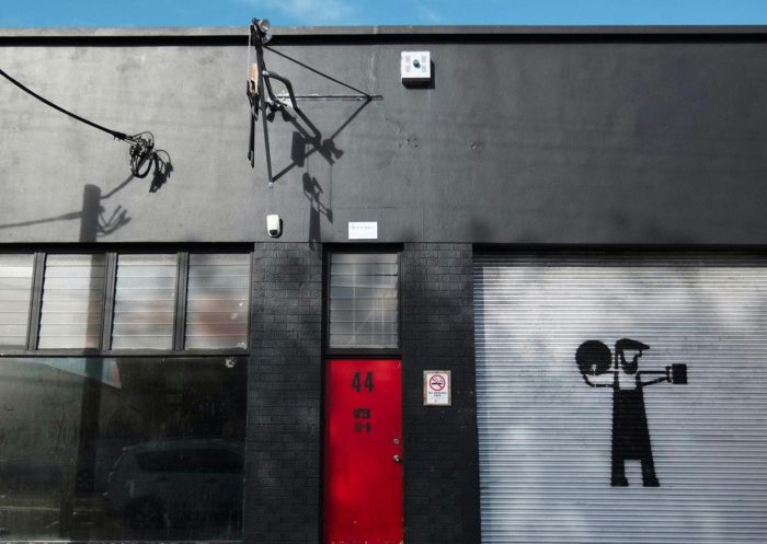 Outside of the brewery with signature red door at Batch Brewing Company, Marrickville