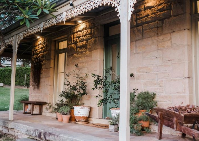 Simpson Cottage Bundeena, Bundeena - Credit: The Curious Collection Front verandah in the evening at Simpson Cottage Bundeena, Bundeena