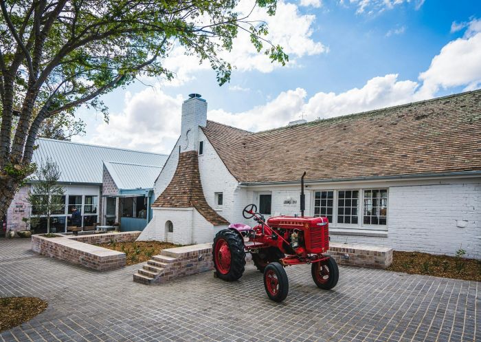 Camden Valley Inn, Camden A tractor parked outside an old cottage at Camden Valley Inn in Camden