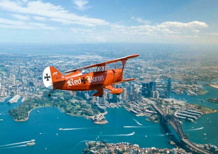 Red Baron Biplane over Sydney Harbour - Credit: Red Baron Adventures