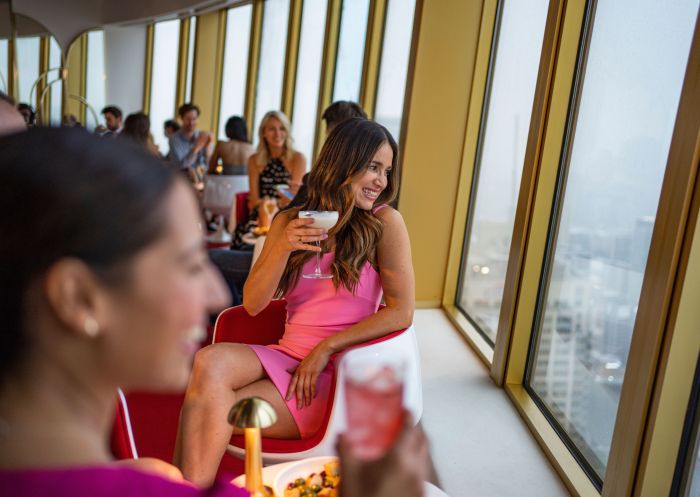 Friends enjoying drinks with views across Sydney, Bar 83 at Sydney Tower, Sydney CBD