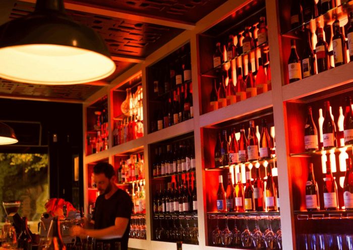 The Wine Library, Woollahra - Credit: The Wine Library Bartender arranging wine, The Wine Library, Woollahra - Credit: The Wine Library