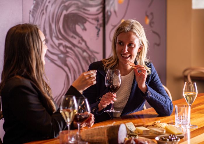 Fix Wine Bar + Restaurant, Sydney CBD - Credit: Fix Wine Bar + Restaurant Two women at the bar drinking wine and eating a cheese board, Fix Wine Bar + Restaurant, Sydney CBD - Credit: Fix Wine Bar + Restaurant