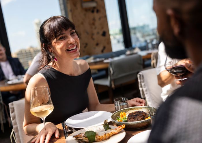 A couple enjoys drinks and delicious food, Kiln, Surry Hills