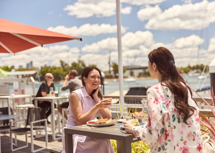 Friends enjoying coffee and a meal, The Lookout cafe, Elizabeth Bay