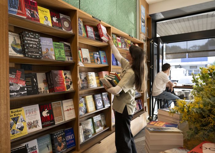 Woman looking at books, Bookoccino, Avalon Beach - Credit: Bookoccino