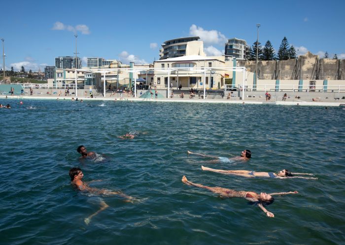 Friends swimming, Newcastle Ocean Baths, Newcastle